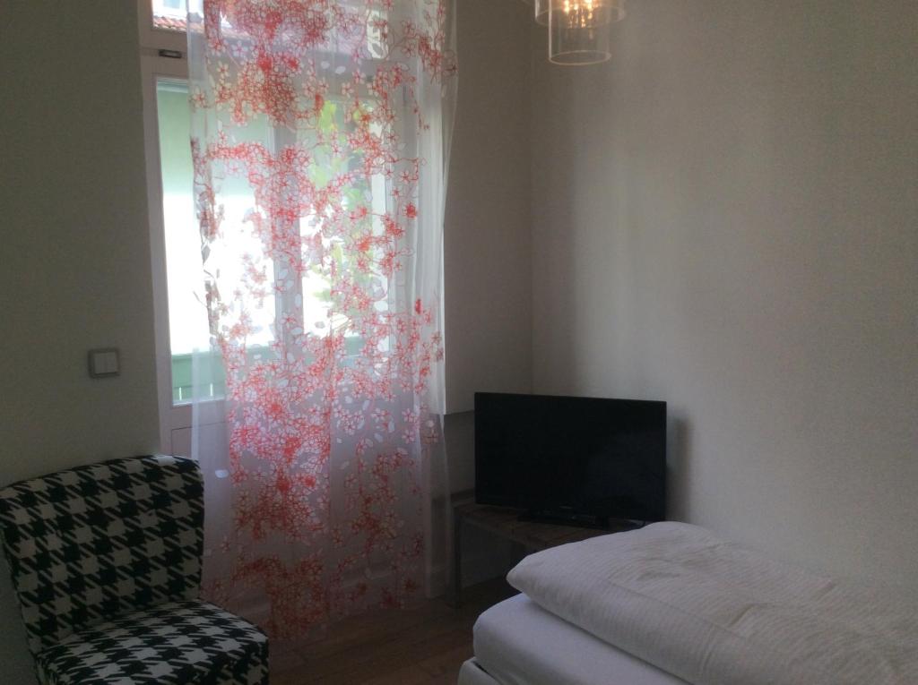 Postel nebo postele na pokoji v ubytování Hotel Heidelberg Astoria