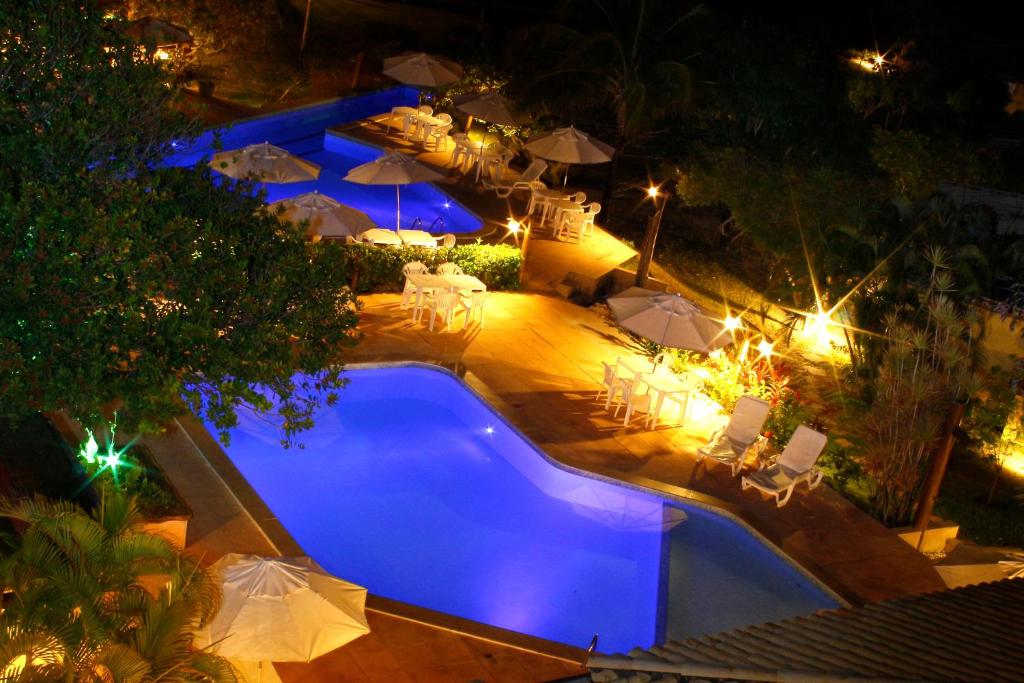 an overhead view of a swimming pool at night at Pousada Bichelenga in Imbassai