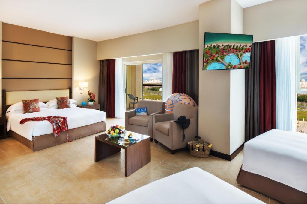 Postel nebo postele na pokoji v ubytování Khalidiya Palace Rayhaan by Rotana, Abu Dhabi