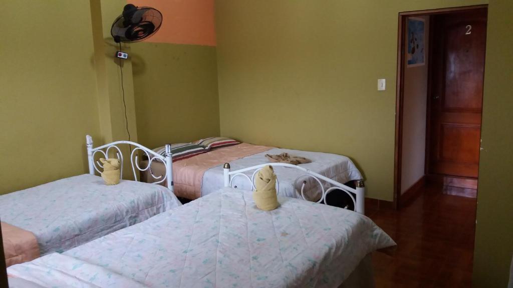 Postel nebo postele na pokoji v ubytování Hostal Dorys Mar