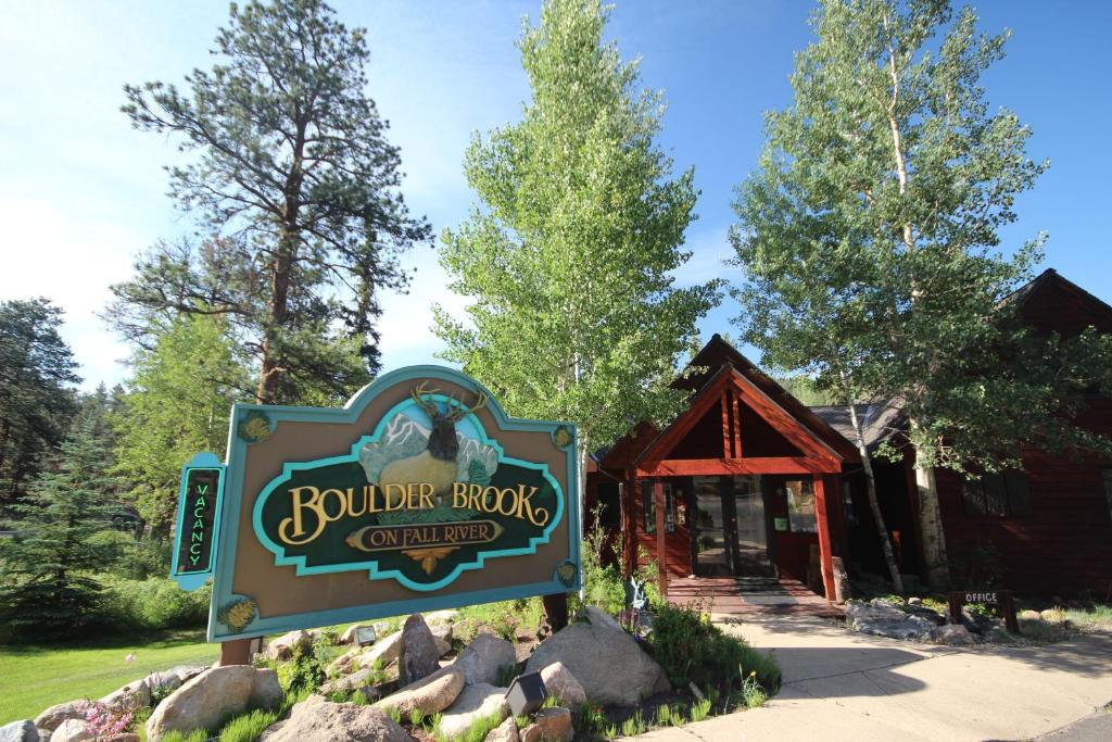 a sign for auburn book center in front of a building at Boulder Brook on Fall River in Estes Park