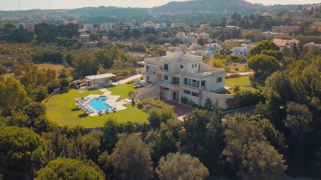 an aerial view of a large white house at Villa Artemis in Koskinou