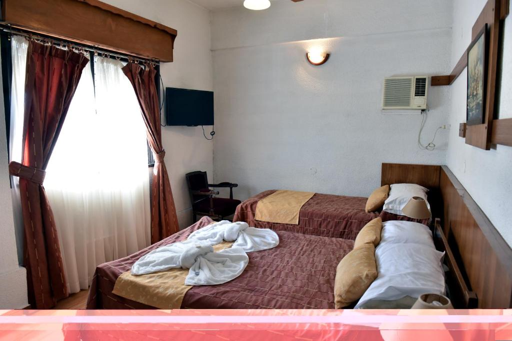 Llit o llits en una habitació de Hotel Gran Litoral