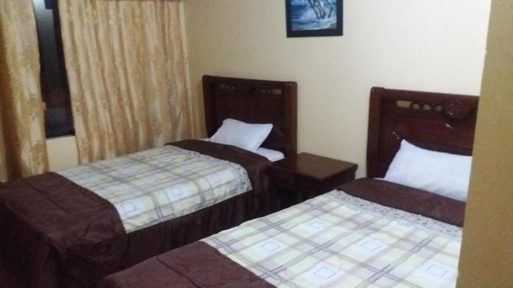 Postel nebo postele na pokoji v ubytování Hotel Navarra