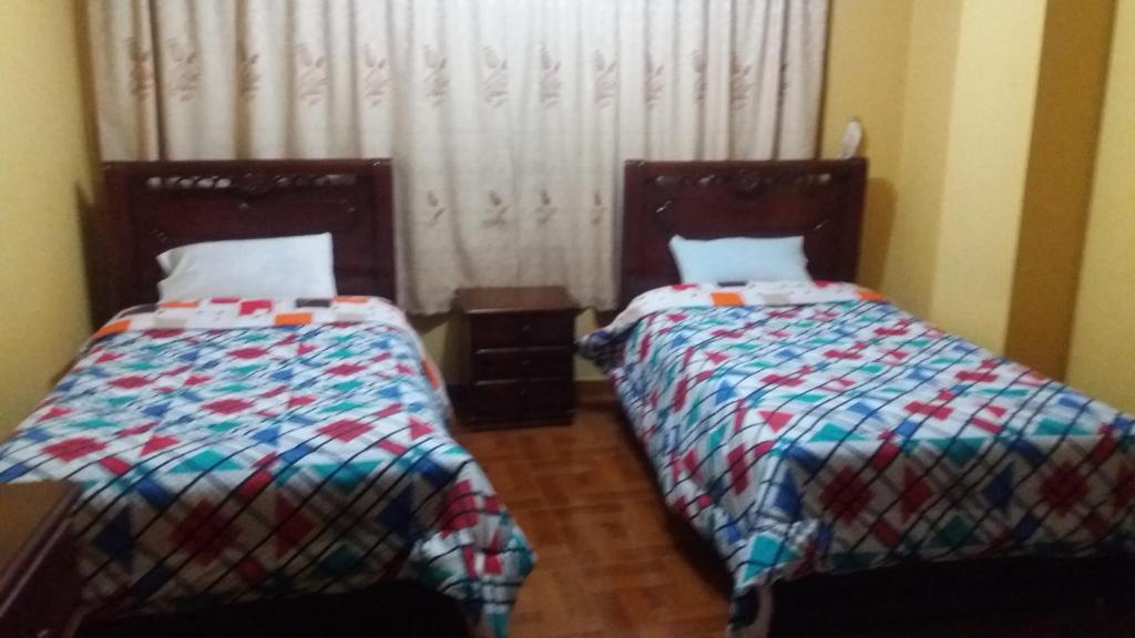 Postel nebo postele na pokoji v ubytování Hotel Navarra