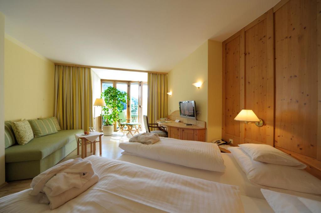 Postel nebo postele na pokoji v ubytování Naturhotel Ortners Eschenhof