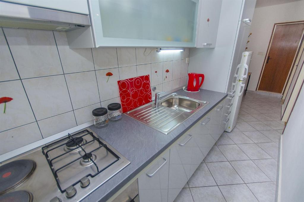Kuchyň nebo kuchyňský kout v ubytování Apartment JeMa