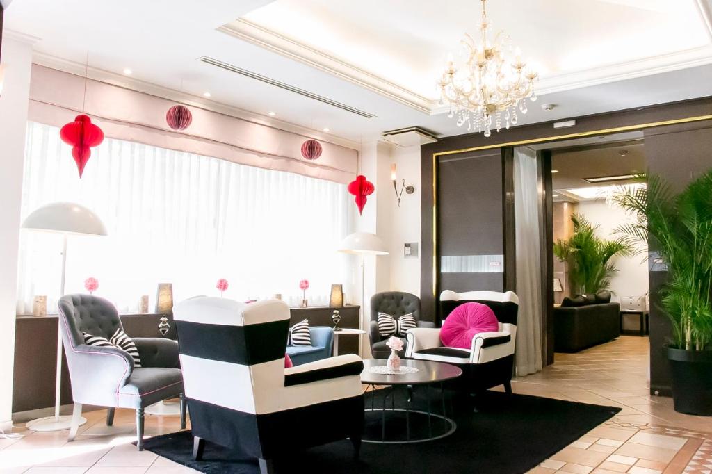a salon with chairs and a waiting room at Grand Park Hotel Panex Tokyo in Tokyo