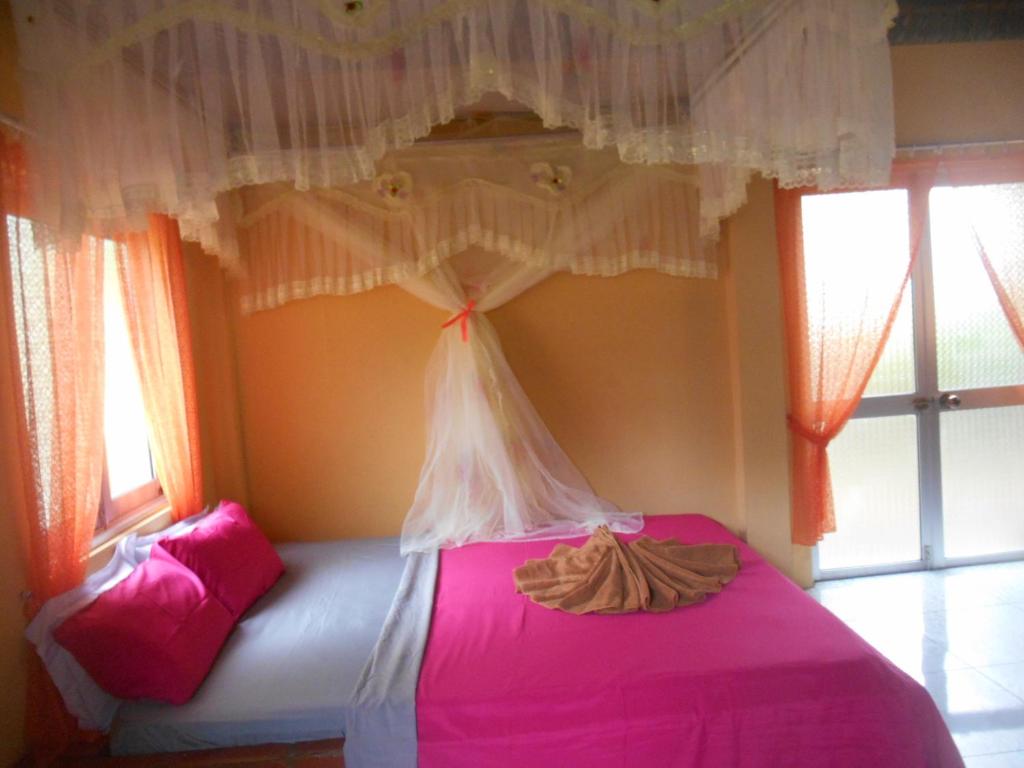 Giường trong phòng chung tại Thuy - Gunter Garden Bungalow