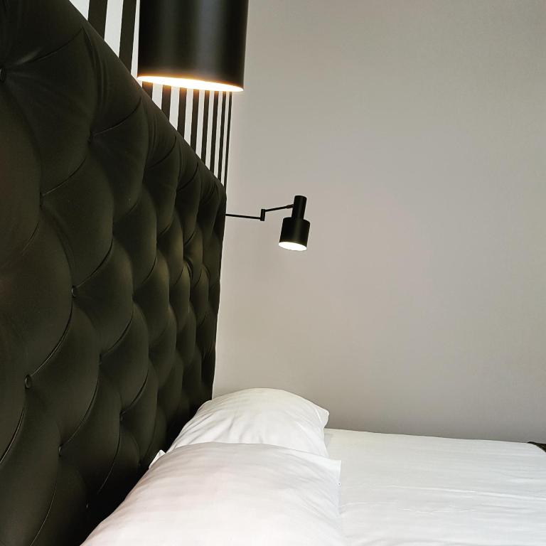 Postel nebo postele na pokoji v ubytování Hotel Zilt