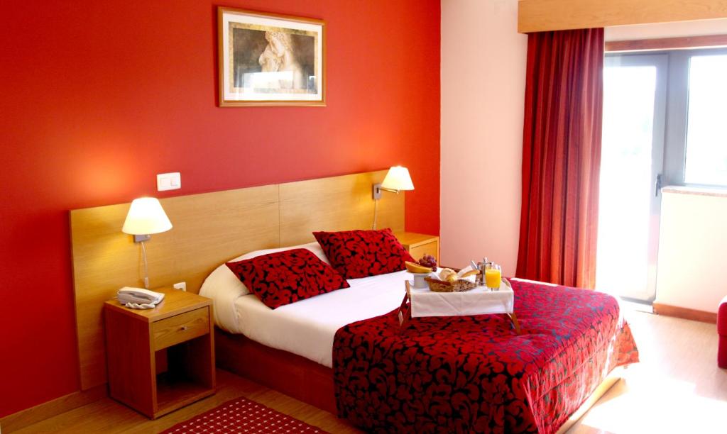 Postel nebo postele na pokoji v ubytování Hotel Durao