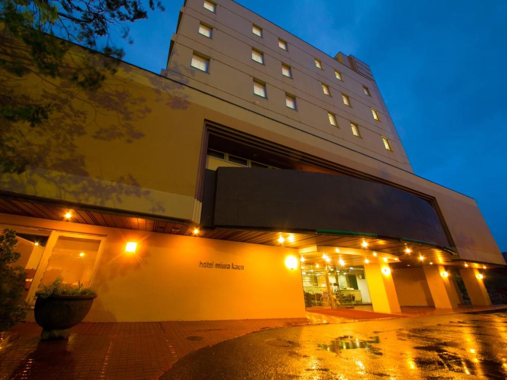 a building with lights on the side of it at hotel miura kaen in Takikawa