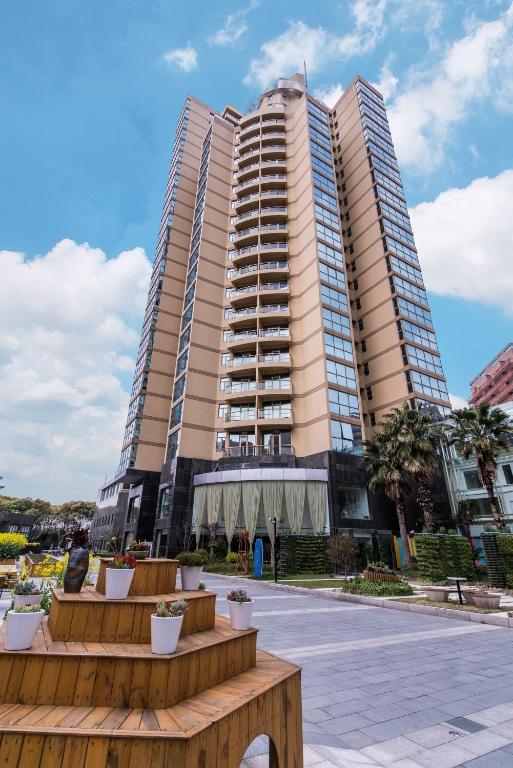 a large apartment building with two tall buildings at Green Court Residence Jinqiao Diamond Shanghai in Shanghai