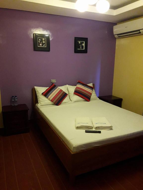 Postel nebo postele na pokoji v ubytování Aqua Travel Lodge