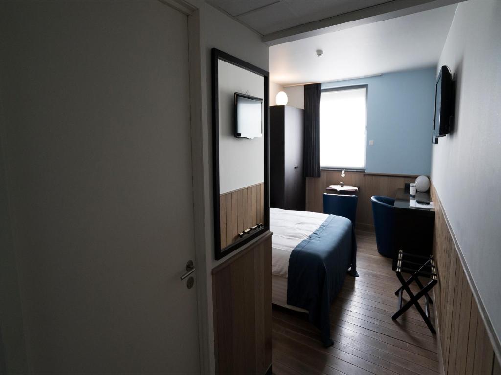 Postel nebo postele na pokoji v ubytování Hotel Orchidee