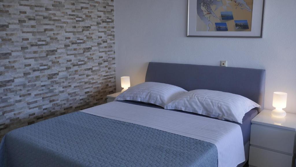 Postel nebo postele na pokoji v ubytování Direkt am Meer-Apartments Puntaplanka