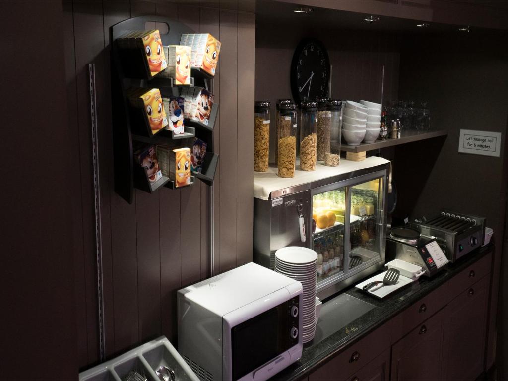 Kuchyň nebo kuchyňský kout v ubytování Hotel Orchidee