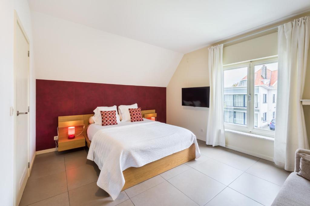 Łóżko lub łóżka w pokoju w obiekcie B&B visavis