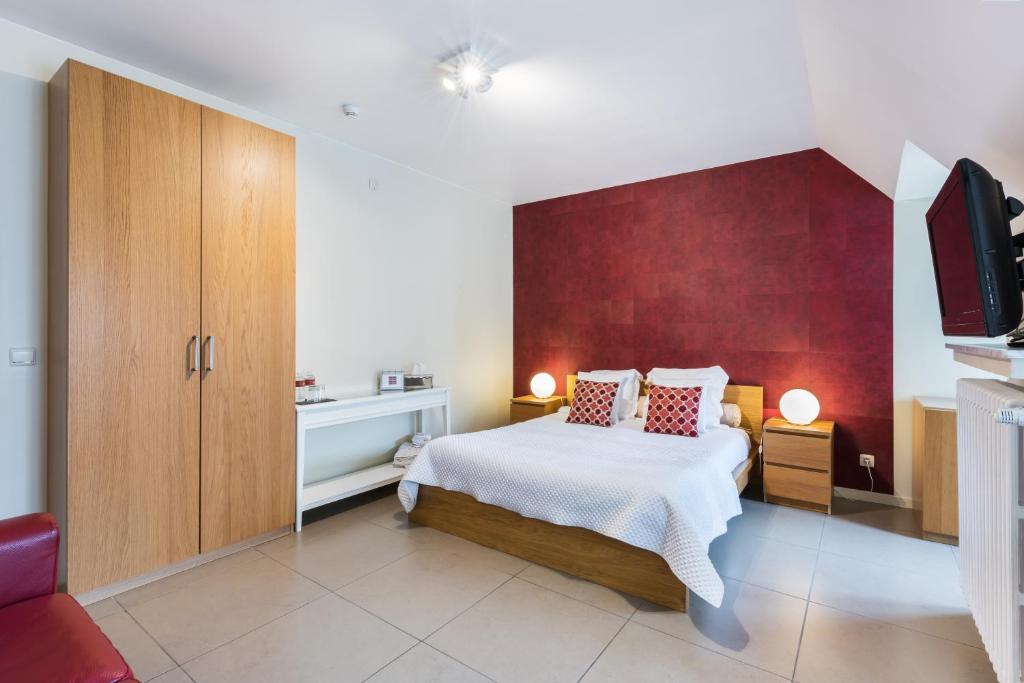 Łóżko lub łóżka w pokoju w obiekcie B&B visavis