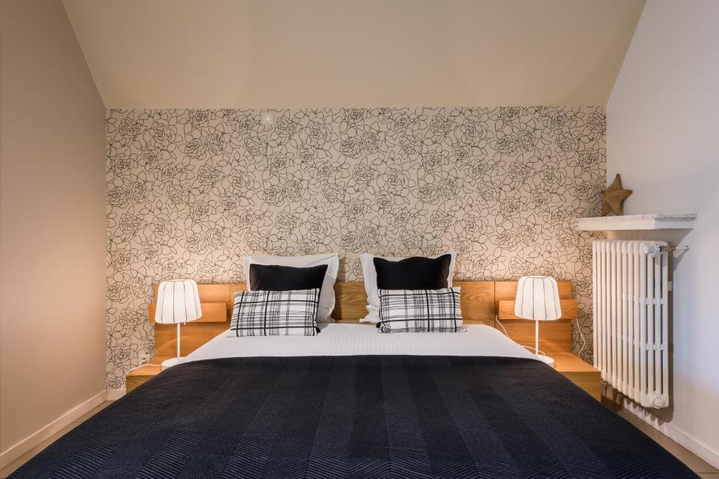 Łóżko lub łóżka w pokoju w obiekcie B&B visavis