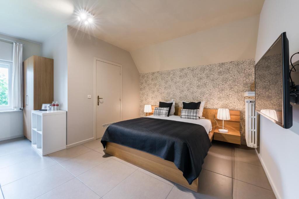 Łóżko lub łóżka w pokoju w obiekcie B&B visavis