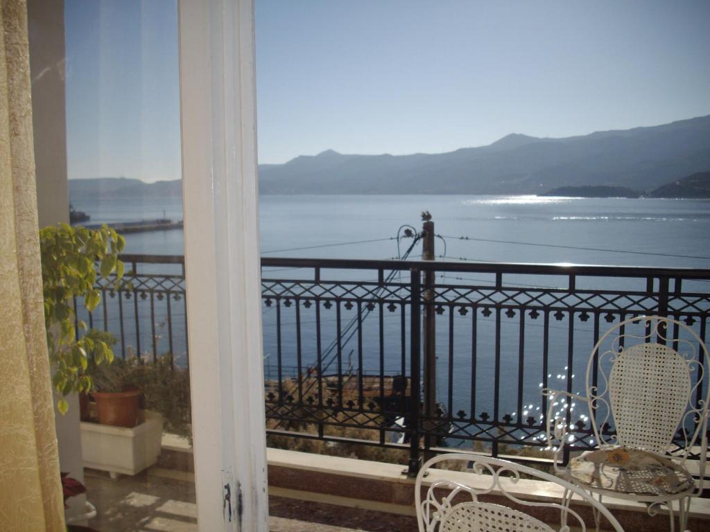 a balcony with a view of the water at Anna in front of the sea Apartment in Sitia