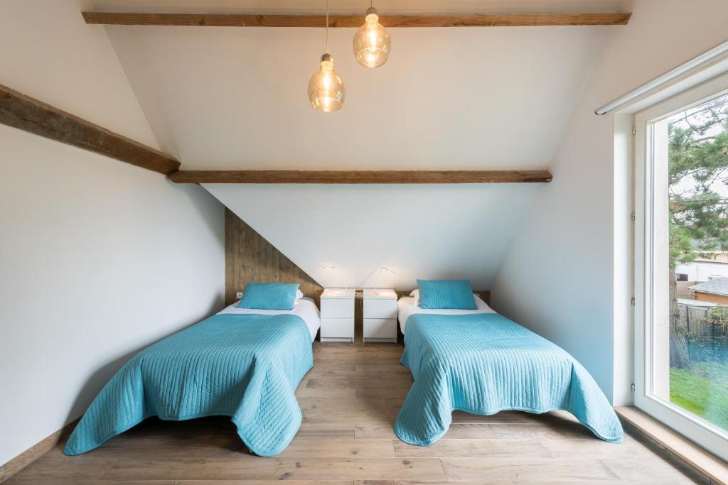 Łóżko lub łóżka w pokoju w obiekcie B&B visavis