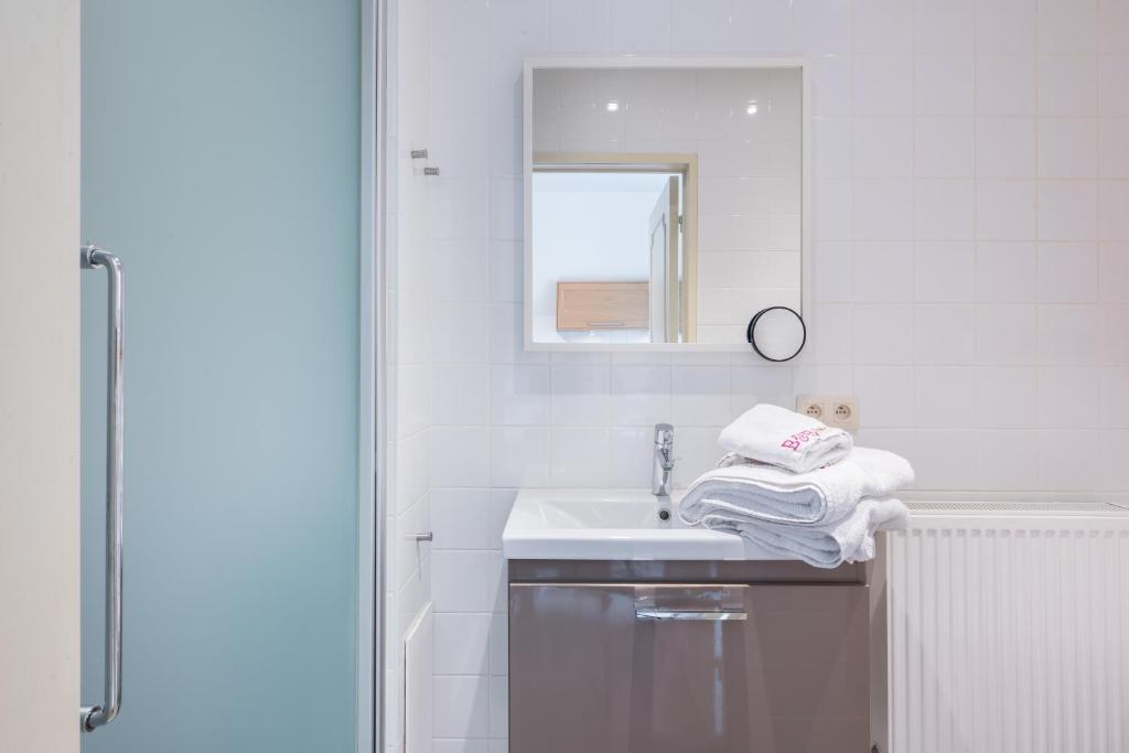 Łóżko lub łóżka w pokoju w obiekcie B&B visavis