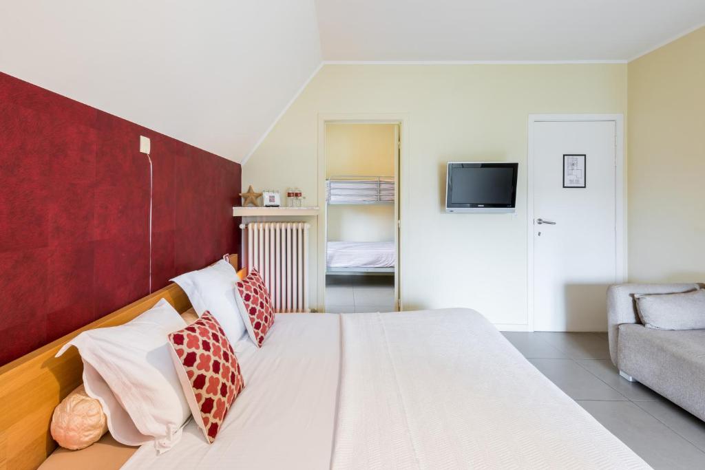 Łóżko lub łóżka w pokoju w obiekcie B&B visavis