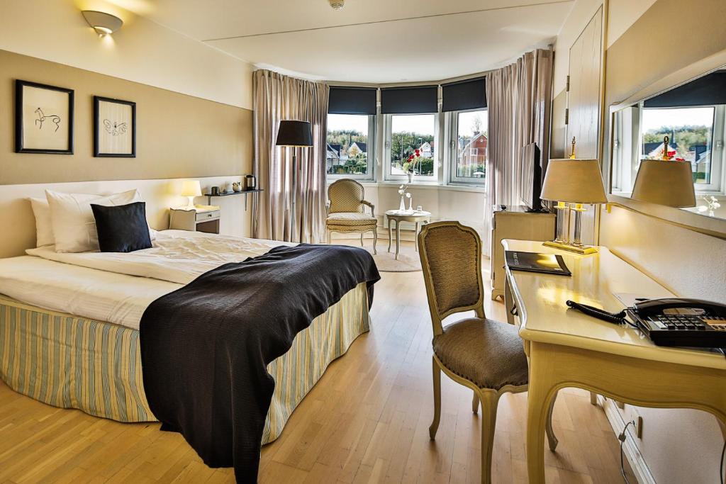 Postel nebo postele na pokoji v ubytování First Hotel Olofström