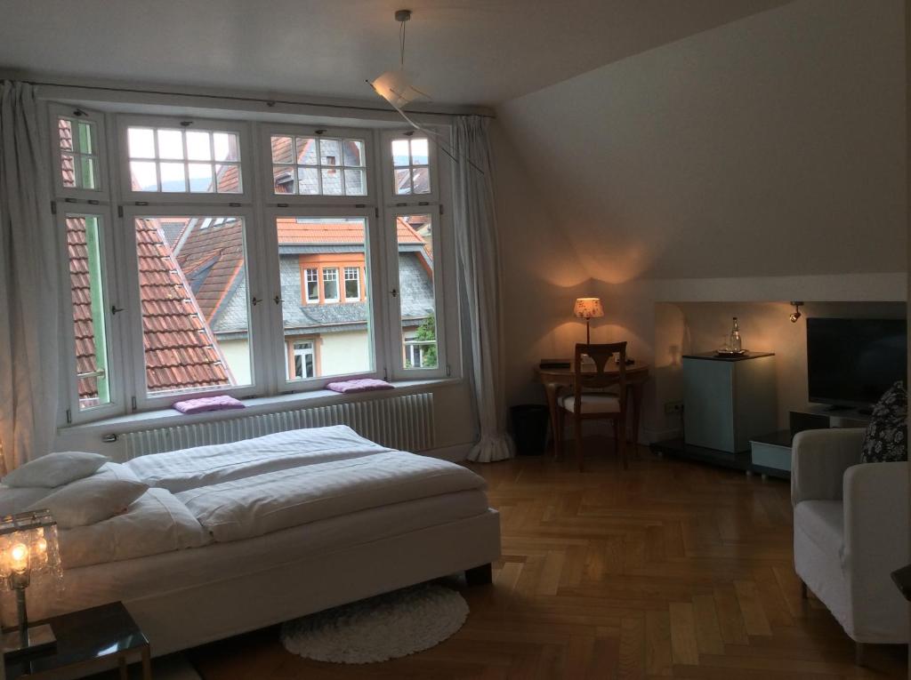 Postel nebo postele na pokoji v ubytování Hotel Heidelberg Astoria