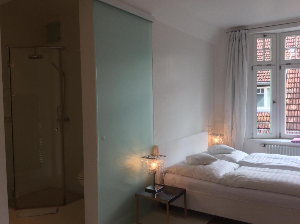 Postel nebo postele na pokoji v ubytování Hotel Heidelberg Astoria