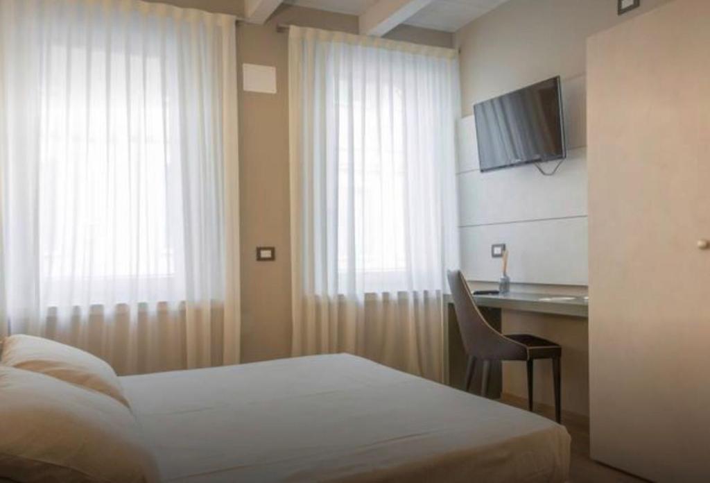 Postel nebo postele na pokoji v ubytování Accademia 21