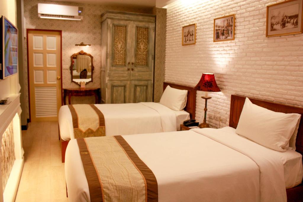 เตียงในห้องที่ ชูชัยบุรี ศรีอัมพวา