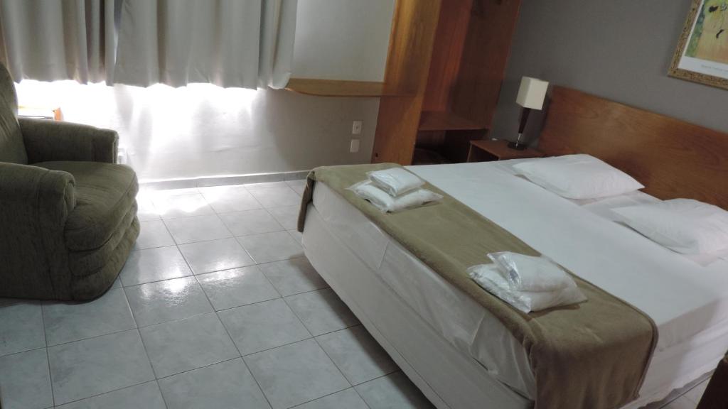 Postel nebo postele na pokoji v ubytování Presidente Hotel