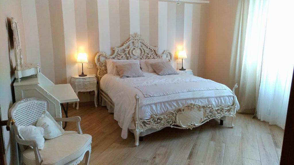 Postel nebo postele na pokoji v ubytování La Valinfiore Charming Home