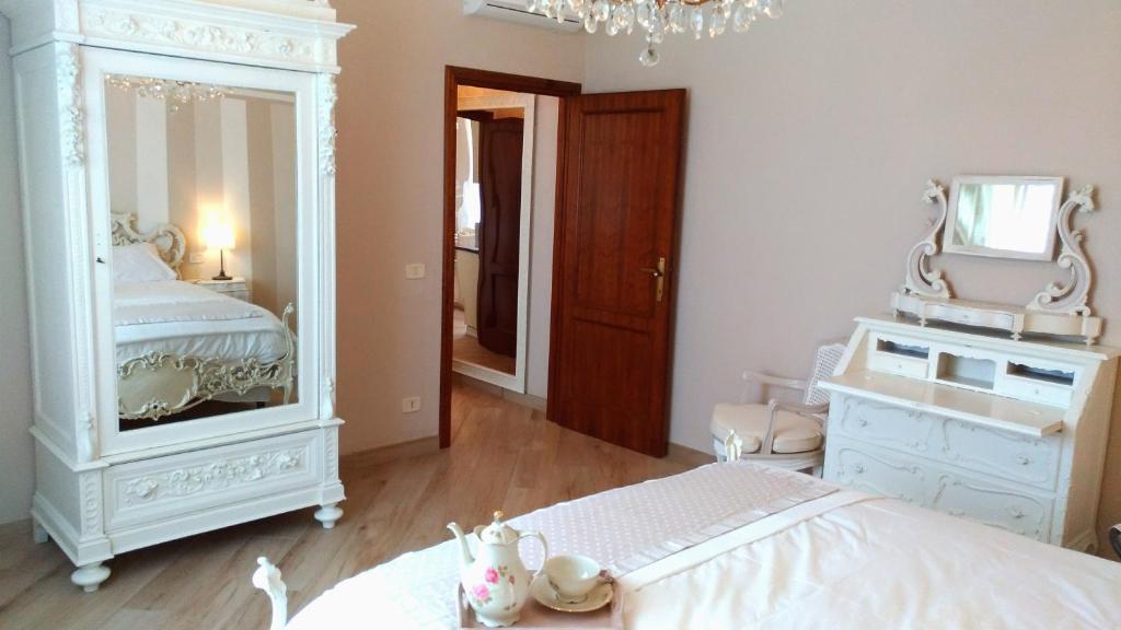 Postel nebo postele na pokoji v ubytování La Valinfiore Charming Home