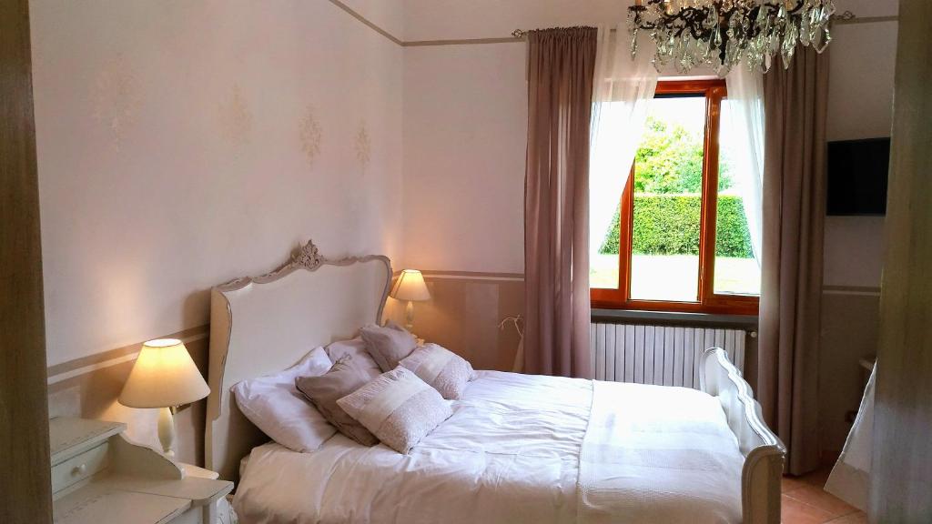 Postel nebo postele na pokoji v ubytování La Valinfiore Charming Home