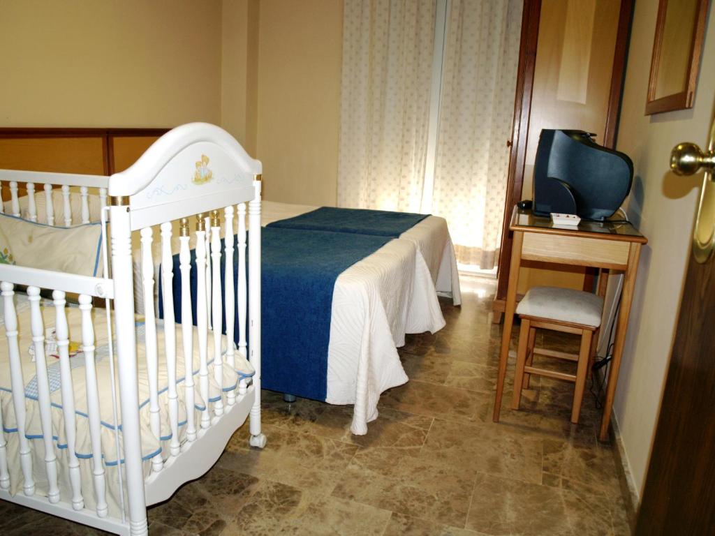Postel nebo postele na pokoji v ubytování Hotel Al-Yussana