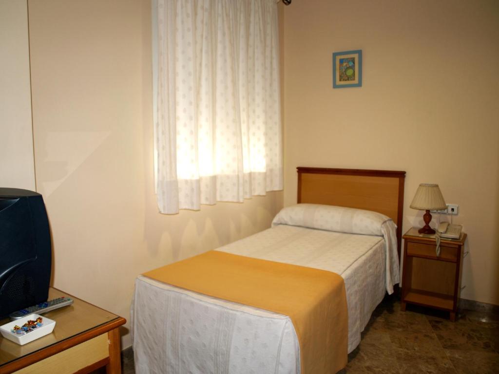 Postel nebo postele na pokoji v ubytování Hotel Al-Yussana