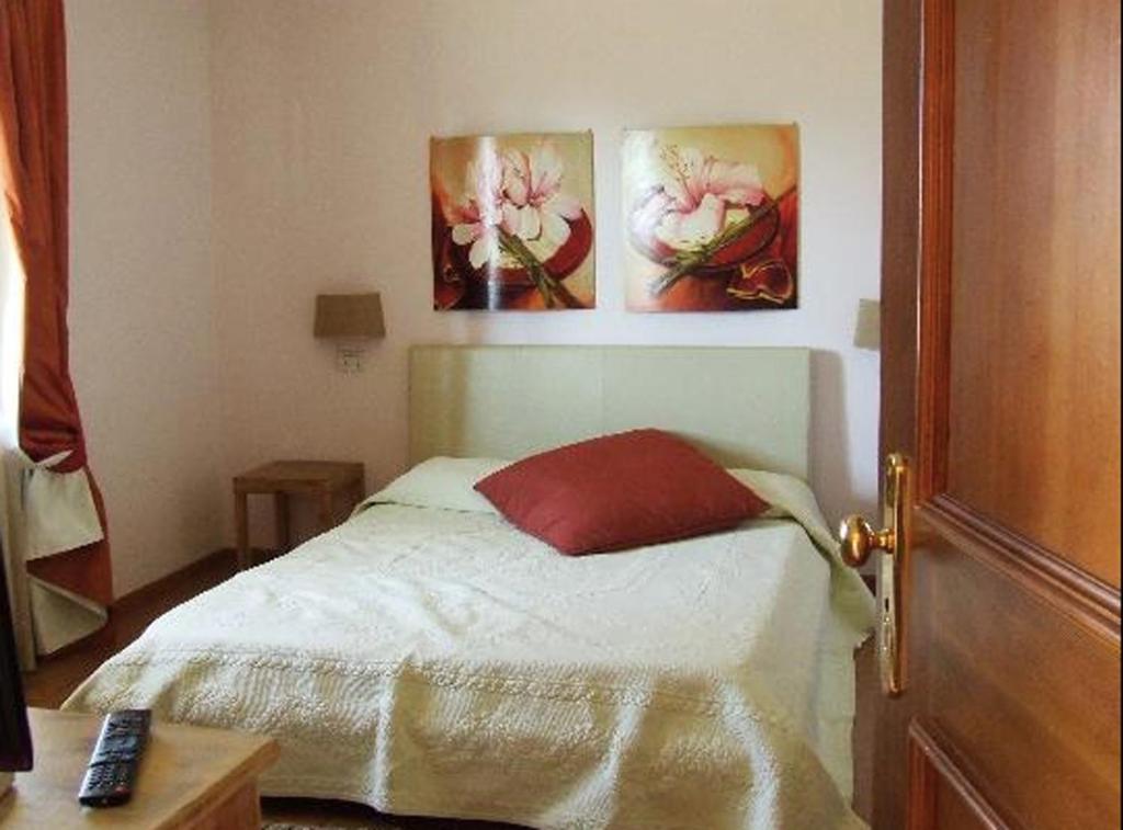 Łóżko lub łóżka w pokoju w obiekcie Il Baio Relais & Natural Spa