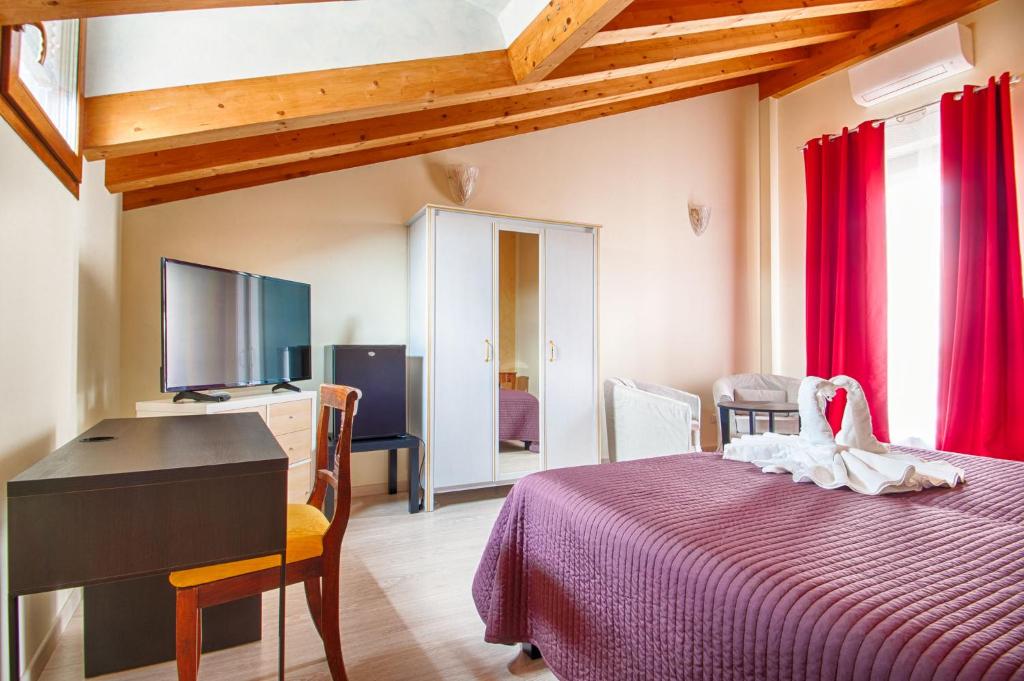 Postel nebo postele na pokoji v ubytování Lady Verona Residence