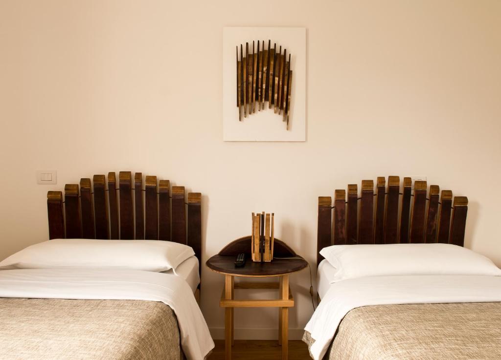 Postel nebo postele na pokoji v ubytování Cincinnato Wine Resort