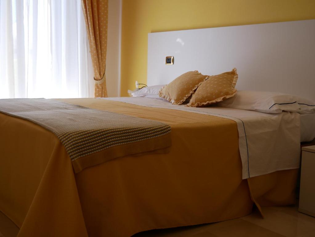 Postel nebo postele na pokoji v ubytování Donna Nicla B&B