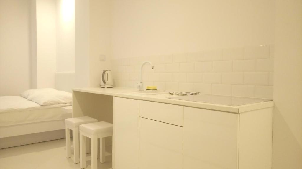 Postel nebo postele na pokoji v ubytování Mirror Apartments