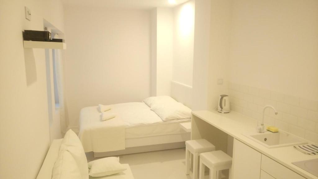Postel nebo postele na pokoji v ubytování Mirror Apartments