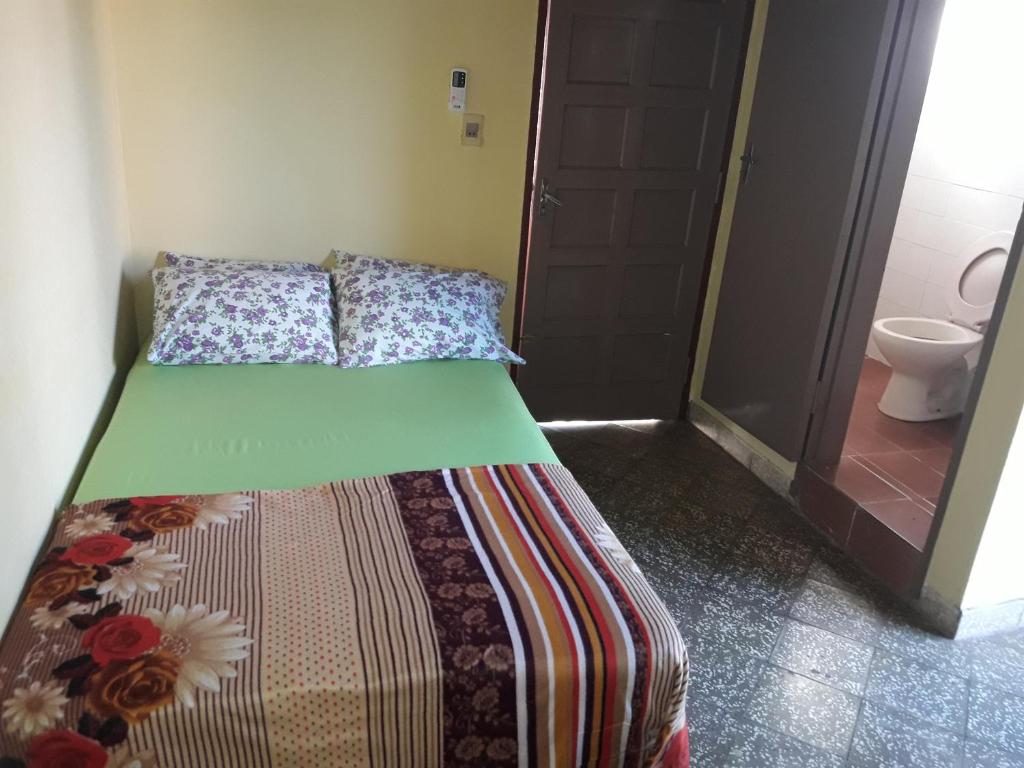 Postel nebo postele na pokoji v ubytování Nueva Alborada Lodging House
