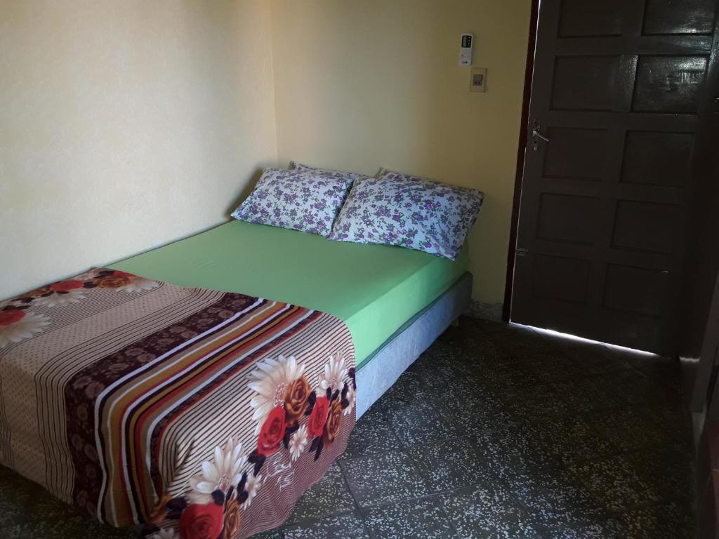 Postel nebo postele na pokoji v ubytování Nueva Alborada Lodging House