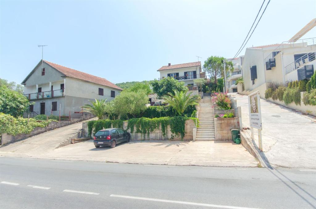 a car parked in a parking lot on the side of a street at Apartment Marko in Tivat