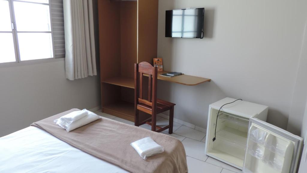 Postel nebo postele na pokoji v ubytování Presidente Hotel
